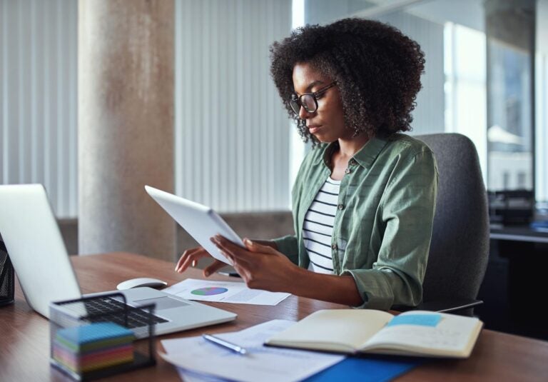 Woman reading notepad