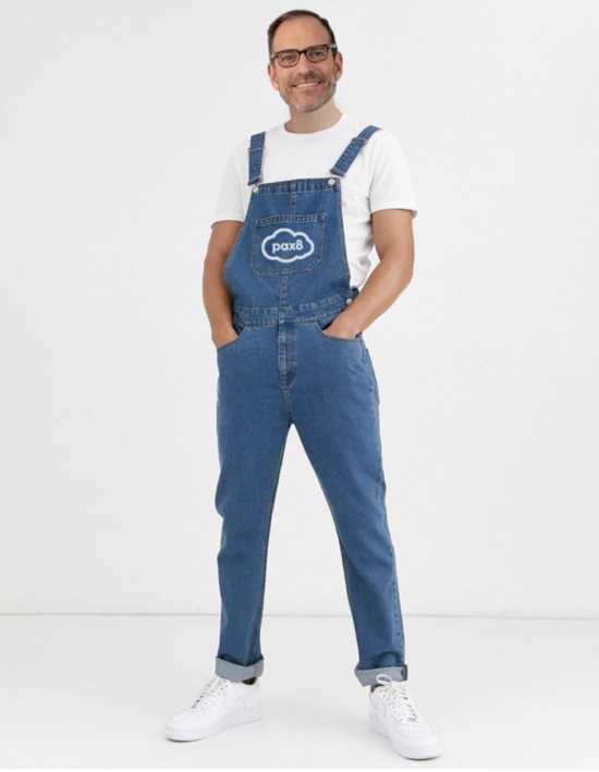 Ryan Walsh wearing Pax8-branded denim overalls