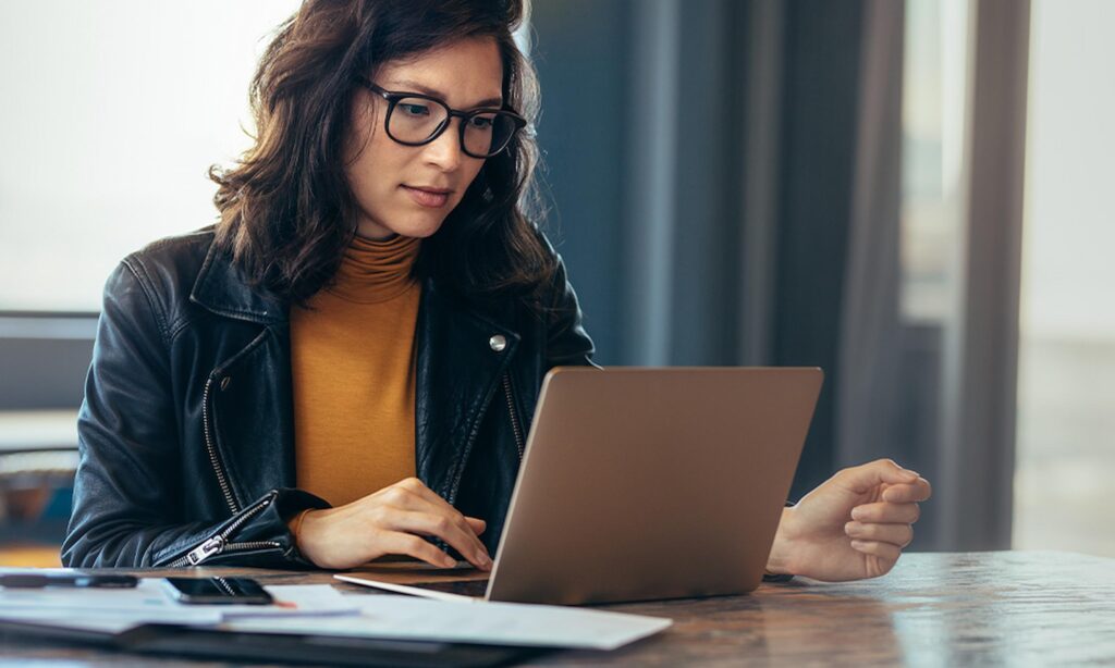 Woman looking at laptop