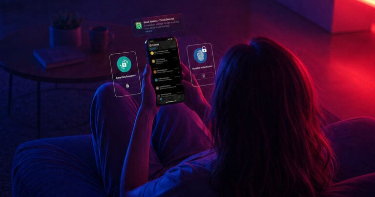 woman holding smartphone with email security overlays
