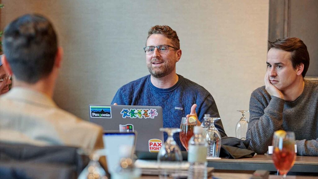 GCIT and Pax8 employees meet face-to-face to discuss cyber insurance rates.