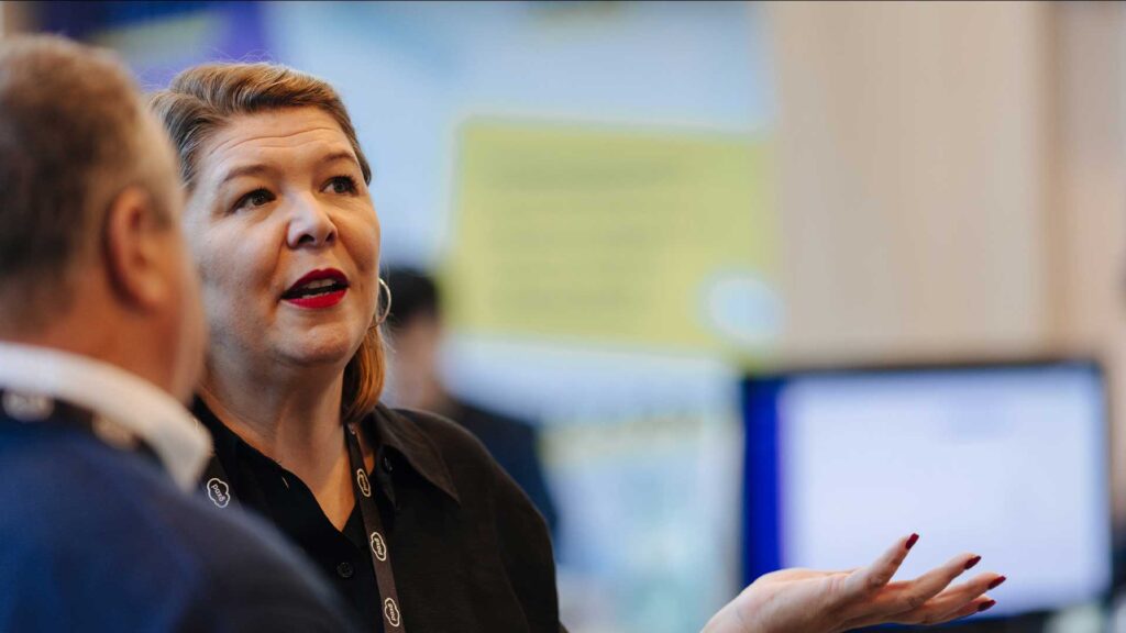 A male and female are contemplative mid discussion about Pax8 security solutions.