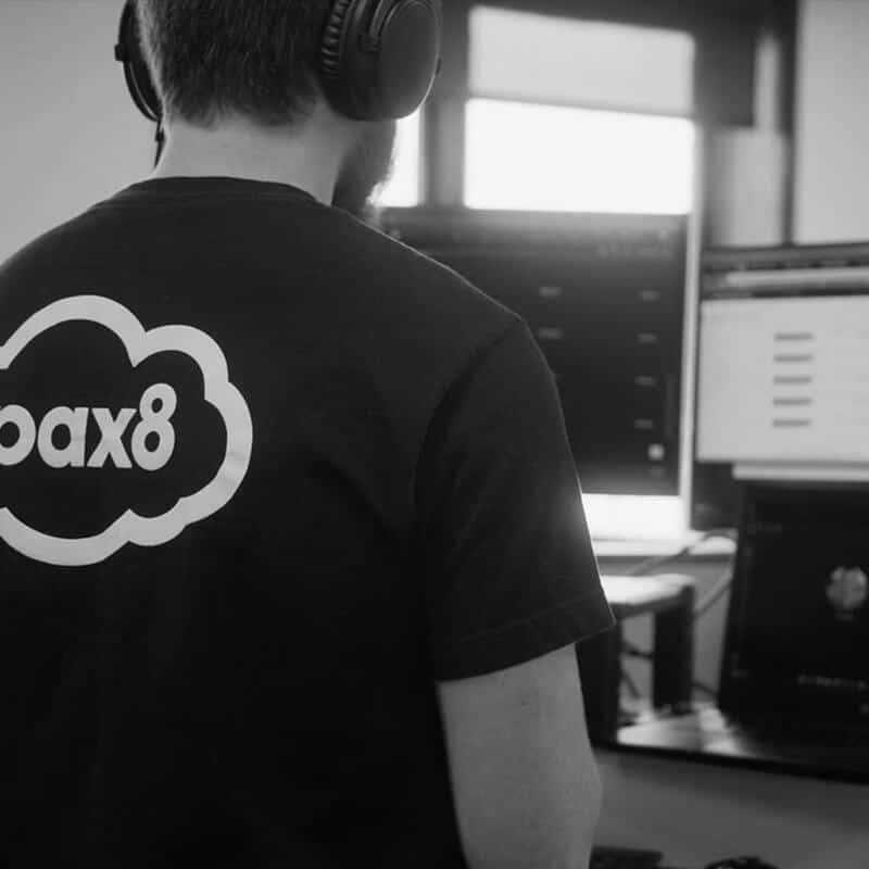 Pax8 employee working at a desk