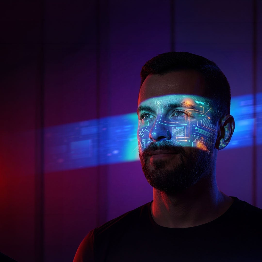 interface-projected-on-mans-face-with-blue-and-purple-lighting-mobile.jpeg