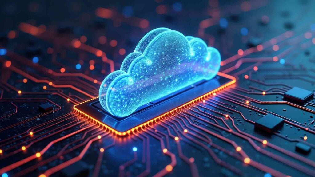 A digital cloud sits on top of a computer chip, symbolizing cloud infrastructure.